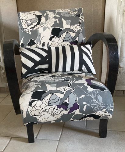 Two armchairs in natural wood, one of them...