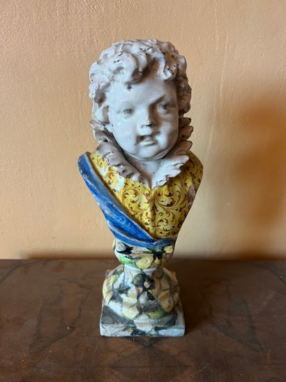Bust of child in earthenware, the pedestal...