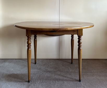 Table in fruit wood, the round tray with...