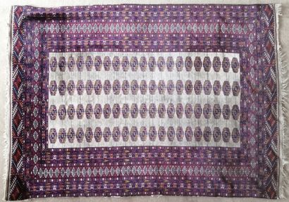 Oriental wool carpet decorated with gühls...