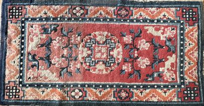 Small carpet from China with a coral red...