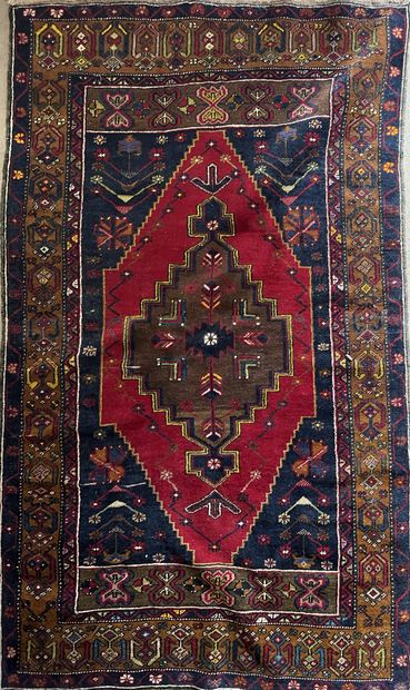 Oriental wool carpet decorated with a diamond...