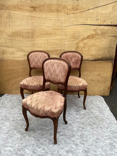 
Three chairs in molded natural wood, the...