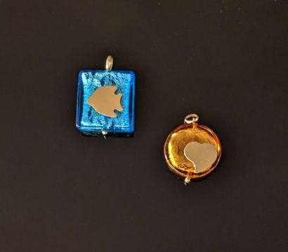 Two glass pendants with silver pearls, one...