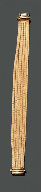 Flexible bracelet in 18K (750) yellow gold,...