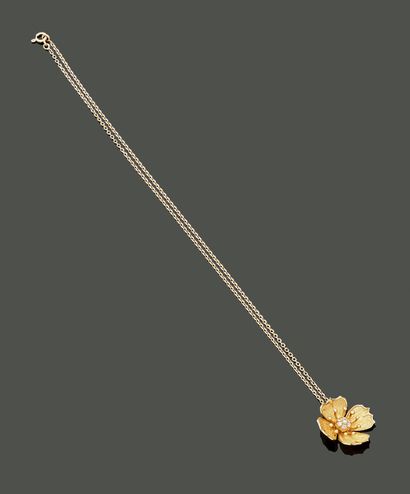Pendant representing a flower and a chain...