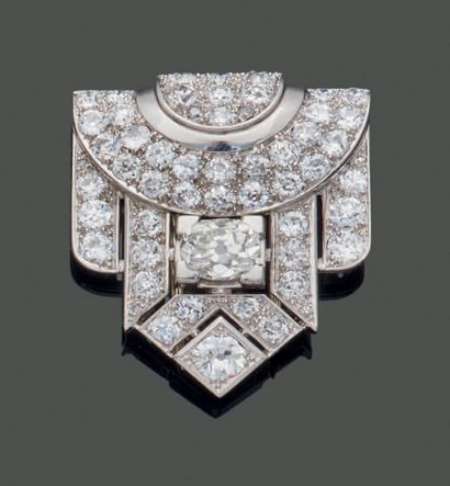 Platinum lapel clip in the form of a stylized...