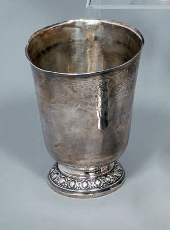Silver tulip kettle standing on a pedestal...