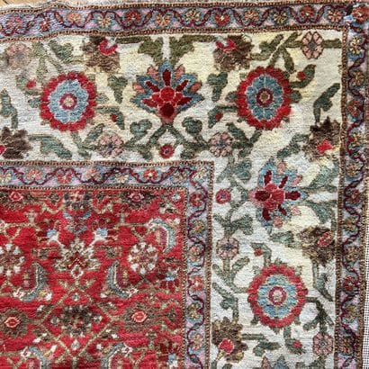 Oriental wool carpet decorated with floral...