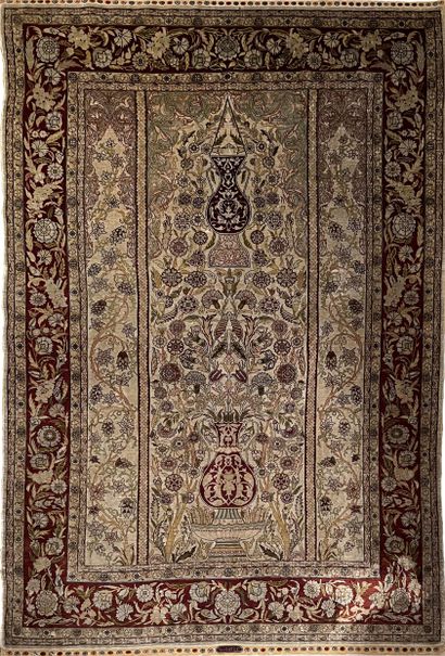Persian carpet in wool and silk decorated...
