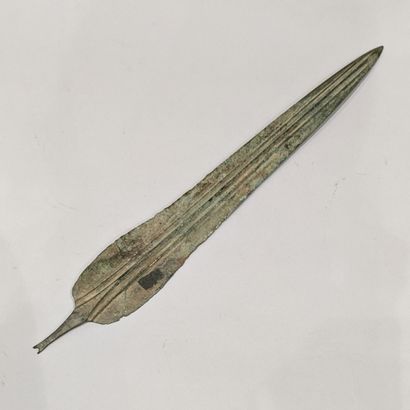 Blade of dagger whose central rib is bordered...