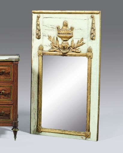 Trumeau in grey and gilded wood, the mirror...