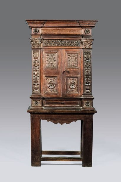 Cabinet in carved fruitwood with inlaid decoration....