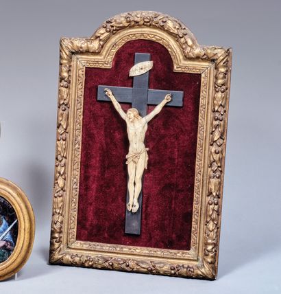 Crucifix. Christ in ivory on a cross in blackened...