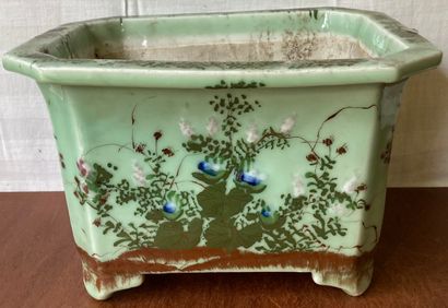 Porcelain planter with cut sides decorated...