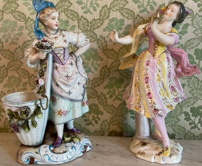 Two polychrome porcelain statuettes: the...