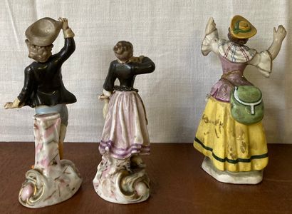Pair of polychrome porcelain statuettes,...