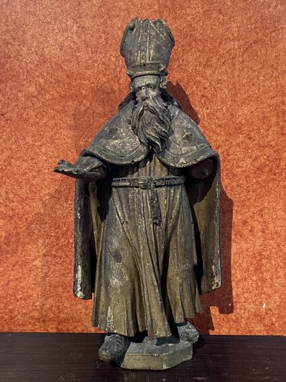 Statue of a bishop in carved wood with gold...