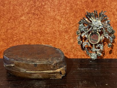 Reliquary with paperolles in a silver plated...