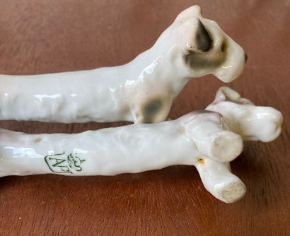 Eight porcelain knife holders, six featuring...