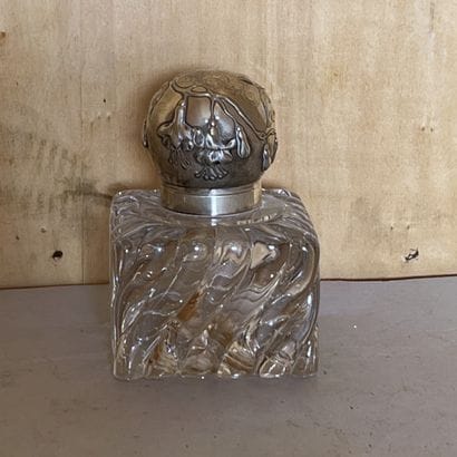 Cubic inkwell with twisted ribs out of moulded...