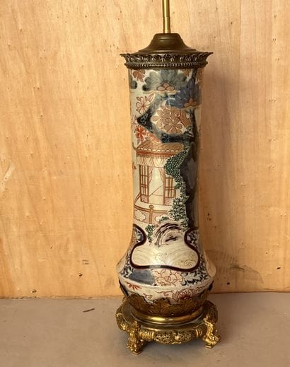 Foot of lamp, the shaft formed of a vase...