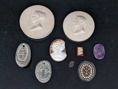 Set of four cameos, one in violet stone....