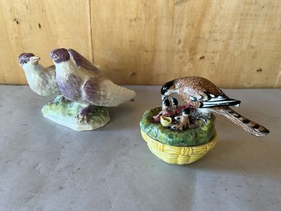 Polychrome porcelain statuette featuring...