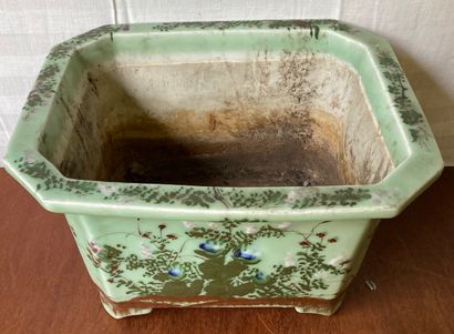 Porcelain planter with cut sides decorated...