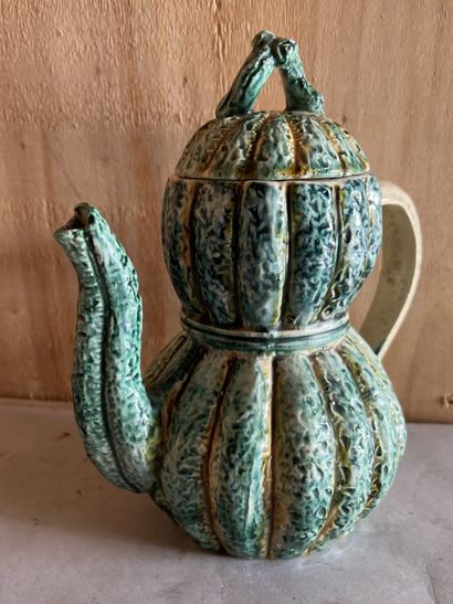 Barbotine earthenware jug featuring a coloquint....