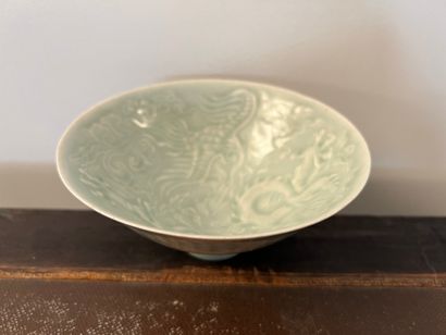 Cup on heel in celadon porcelain. The interior...