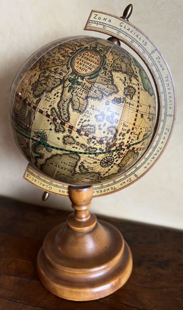 Small world map on a fruitwood stand. Modern....