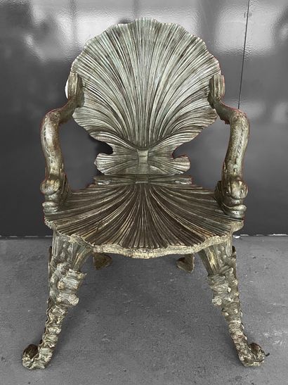 Cave armchair in natural wood with a silver...