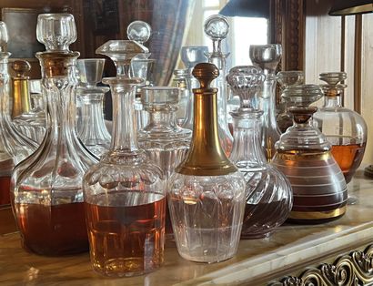 Set of decanters and bottles in glass or...