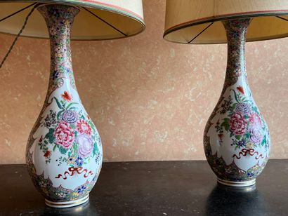 Pair of porcelain bottle vases with polychrome...