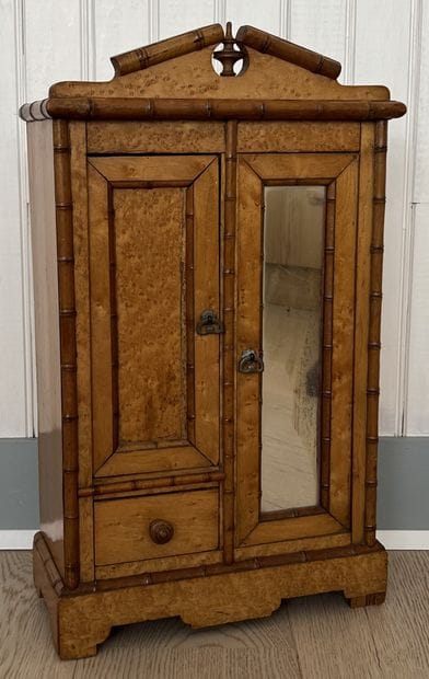 Doll's cabinet in burr and natural wood in...