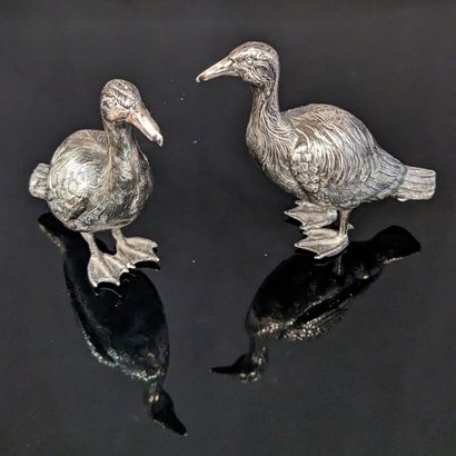 Pair of silver duck statuettes (800), with...