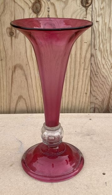 Large horn vase in pink tinted glass. The...