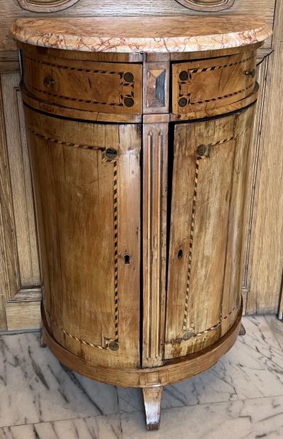 Small half-moon shaped piece of furniture,...