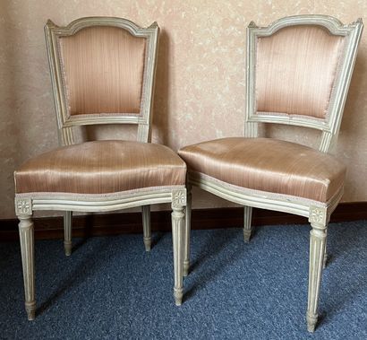Pair of chairs in cream lacquered wood. The...