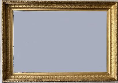 Large stuccoed and gilded wood frame decorated...