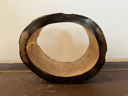 Oval bone base with carved decoration in...