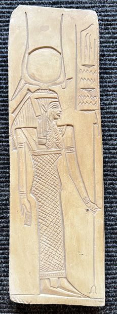 Small bas-relief in patinated stone representing...