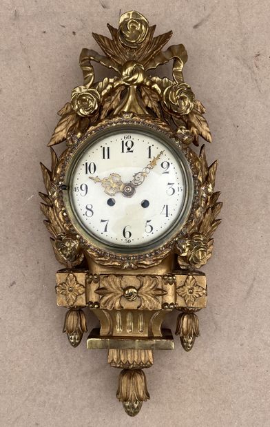 Cartel in gilded wood, the dial surrounded...