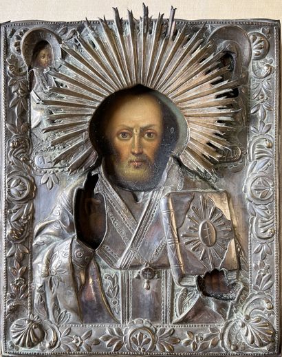Icon and its silver-plated copper reza representing...