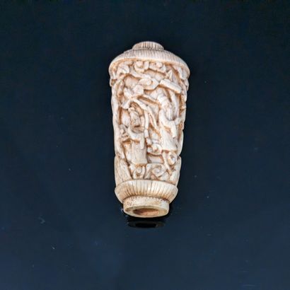 Bone handle carved with characters among...