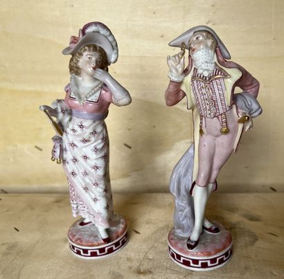 Pair of porcelain statuettes with polychrome...