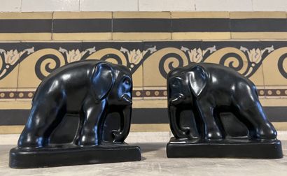 Pair of matte black enameled earthenware...