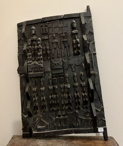 Carved wooden door with characters and animals....