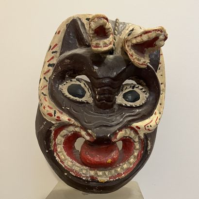 Polychrome painted wood mask with scrolling...